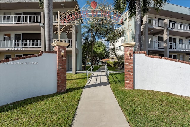250 Layne Blvd Unit 312, Hallandale Beach, FL 33009 - gate featuring a lawn