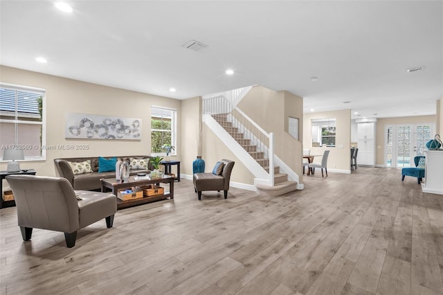 living room with light hardwood / wood-style floors