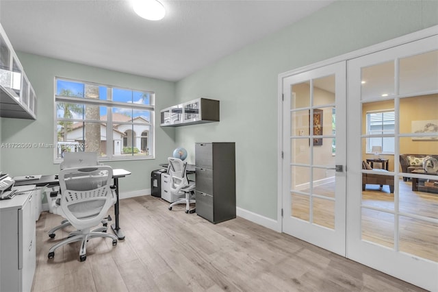 office area featuring light hardwood / wood-style floors and french doors