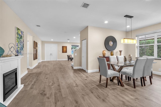 dining space featuring light hardwood / wood-style flooring