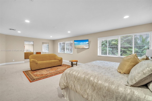 bedroom featuring light carpet