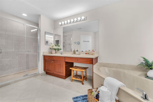 bathroom featuring separate shower and tub, vanity, and tile patterned floors