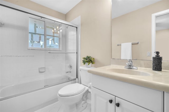 full bathroom with toilet, combined bath / shower with glass door, tile patterned flooring, and vanity