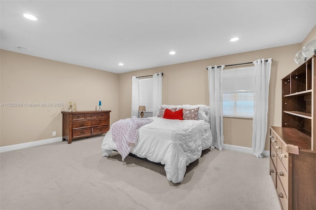 bedroom featuring light carpet