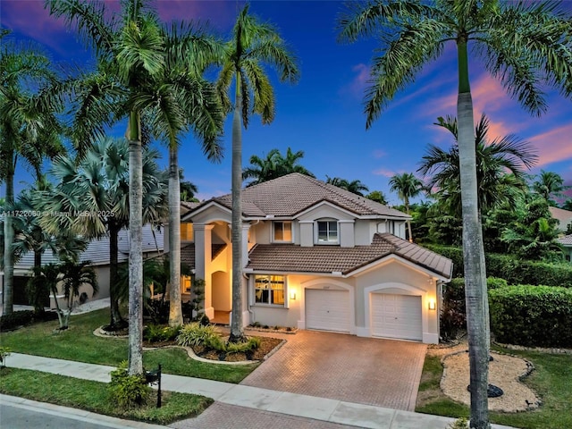 mediterranean / spanish-style house featuring a garage