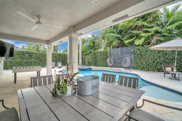 view of swimming pool with an in ground hot tub, ceiling fan, and a patio