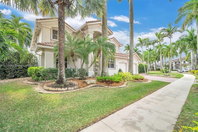 mediterranean / spanish-style house with a front yard