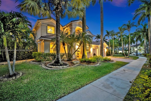 mediterranean / spanish-style house featuring a yard