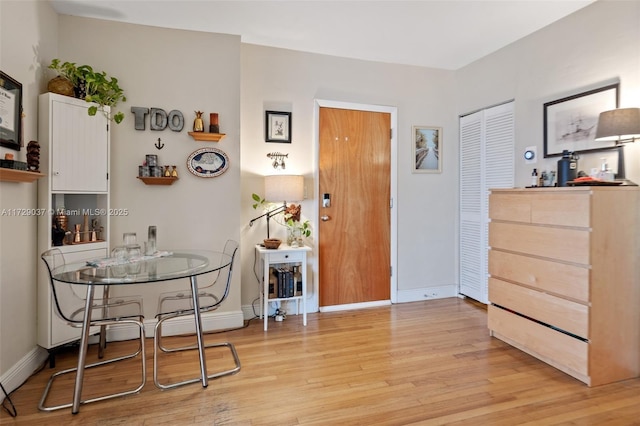 dining space featuring light wood-type flooring