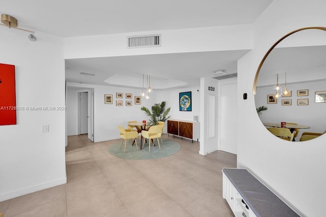 dining space featuring a tray ceiling