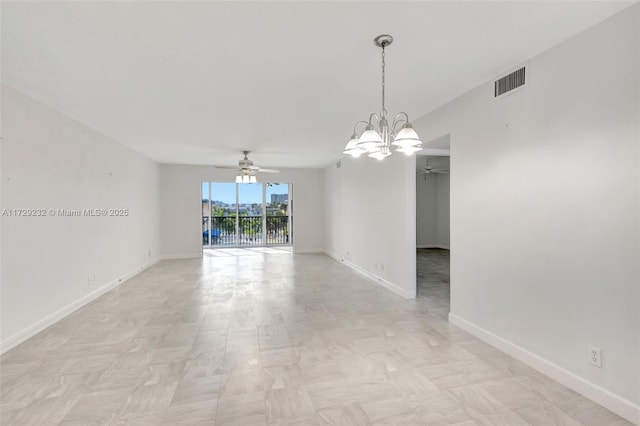 empty room featuring ceiling fan with notable chandelier