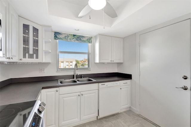 kitchen with electric stove, dishwasher, a raised ceiling, sink, and white cabinets