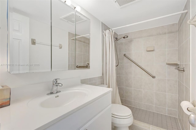 bathroom featuring toilet, a shower with shower curtain, and vanity