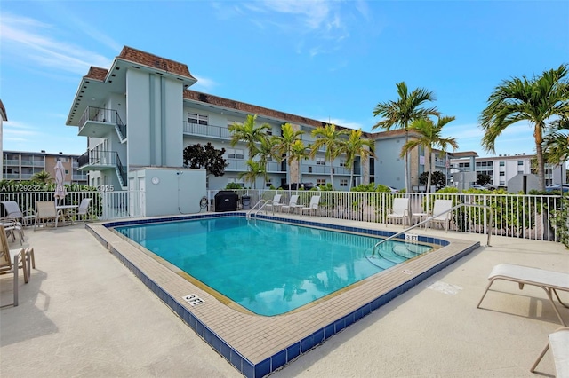 view of swimming pool with a patio area