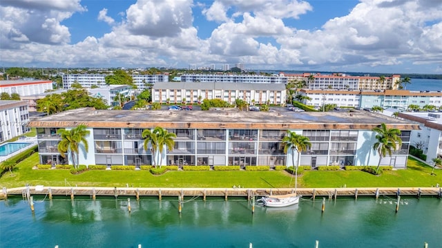 birds eye view of property with a water view