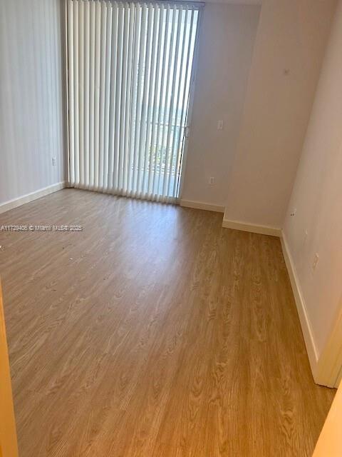 empty room featuring light hardwood / wood-style floors