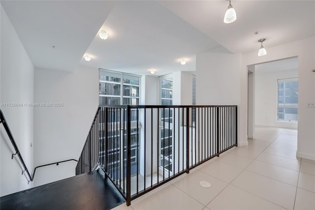 corridor with light tile patterned floors