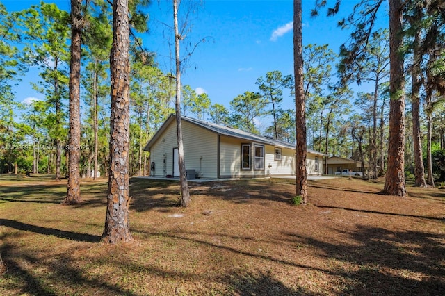 view of property exterior featuring a yard