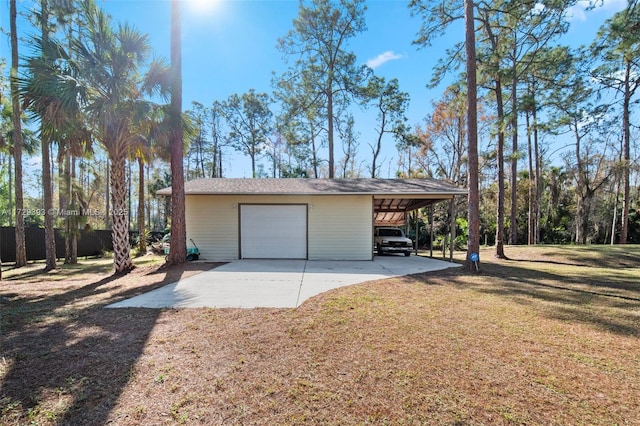 garage with a lawn and a carport