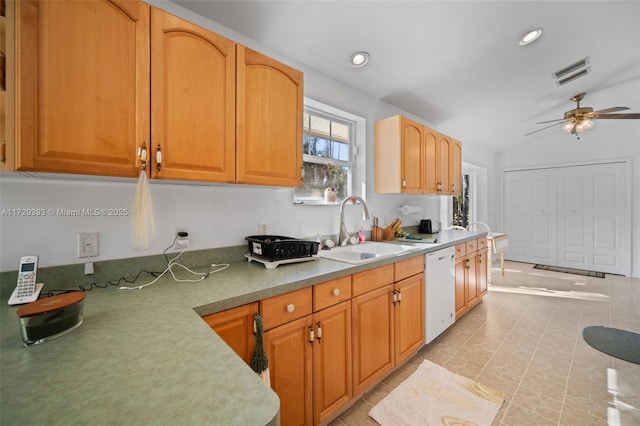 kitchen with vaulted ceiling, ceiling fan, dishwasher, and sink