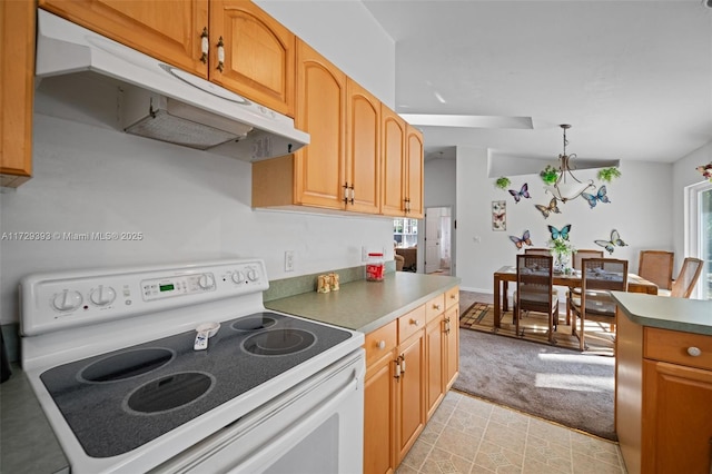 kitchen featuring hanging light fixtures, white electric range, plenty of natural light, and light carpet