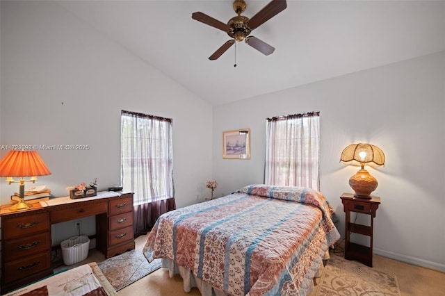 bedroom with ceiling fan, multiple windows, light carpet, and lofted ceiling