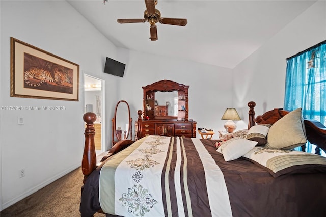 bedroom with ceiling fan, lofted ceiling, and carpet flooring