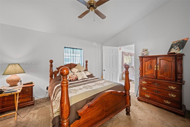 carpeted bedroom featuring vaulted ceiling and ceiling fan