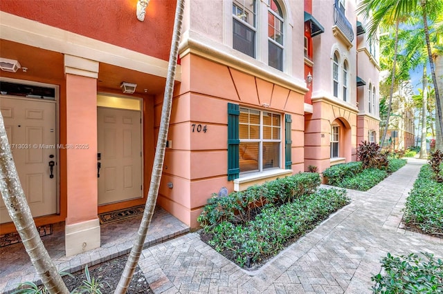 1033 NE 17th Way Unit 704, Fort Lauderdale, FL 33304 - view of exterior entry featuring stucco siding