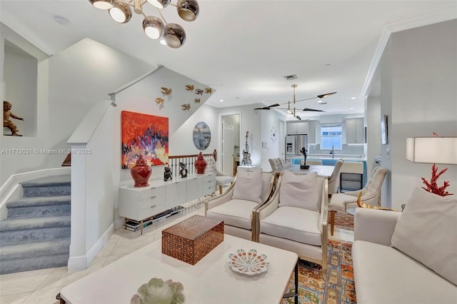 tiled living room with sink and ornamental molding