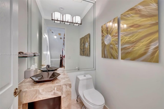 1033 NE 17th Way Unit 704, Fort Lauderdale, FL 33304 - bathroom featuring ornamental molding and vanity