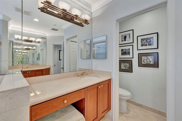 bathroom with tile patterned floors, toilet, crown molding, and a notable chandelier