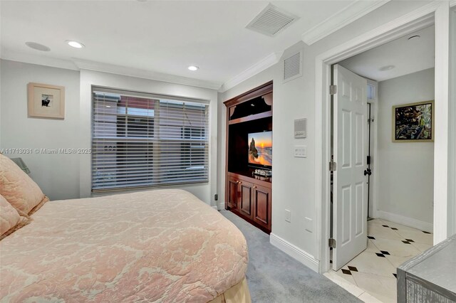 carpeted bedroom with crown molding