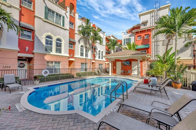 1033 NE 17th Way Unit 704, Fort Lauderdale, FL 33304 - community pool with a patio area and a residential view