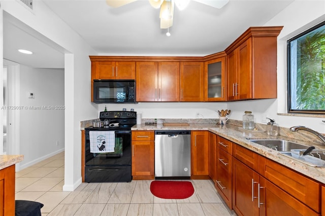 kitchen with black appliances, ceiling fan, sink, light tile patterned flooring, and light stone counters