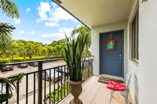 entrance to property featuring a balcony