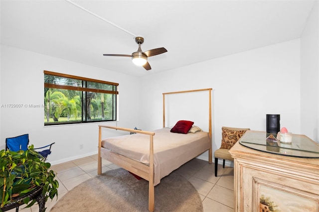 bedroom featuring light tile patterned flooring and ceiling fan