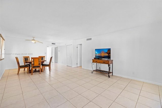 dining area featuring light tile patterned flooring and ceiling fan