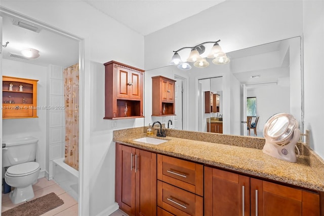 full bathroom featuring tile patterned floors, toilet, shower / bath combo with shower curtain, and vanity