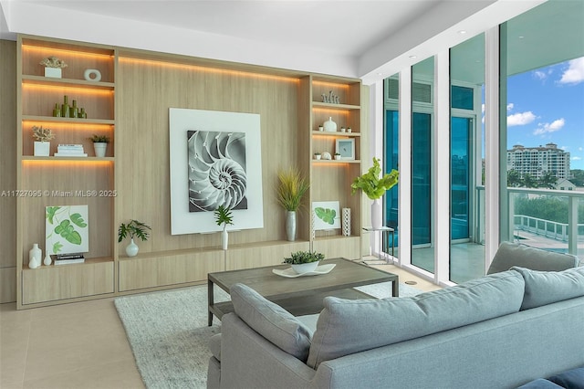 sitting room featuring tile patterned floors and built in features