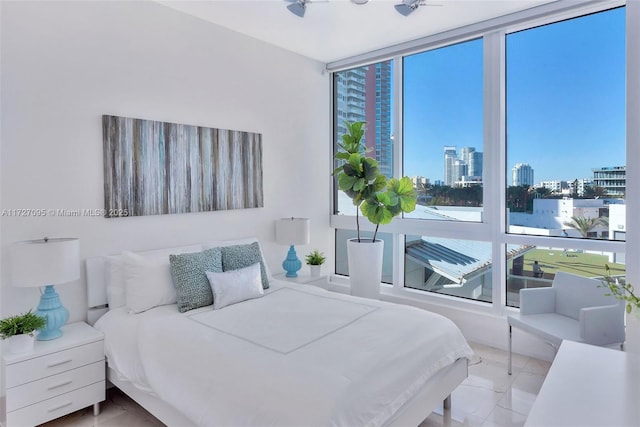 bedroom featuring floor to ceiling windows