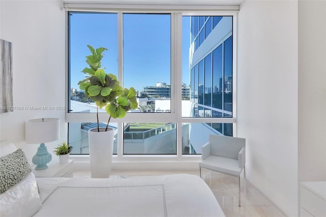 interior space with floor to ceiling windows and multiple windows