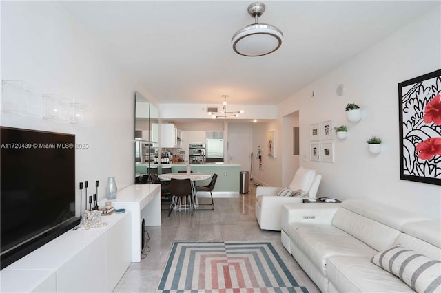 living room featuring an inviting chandelier