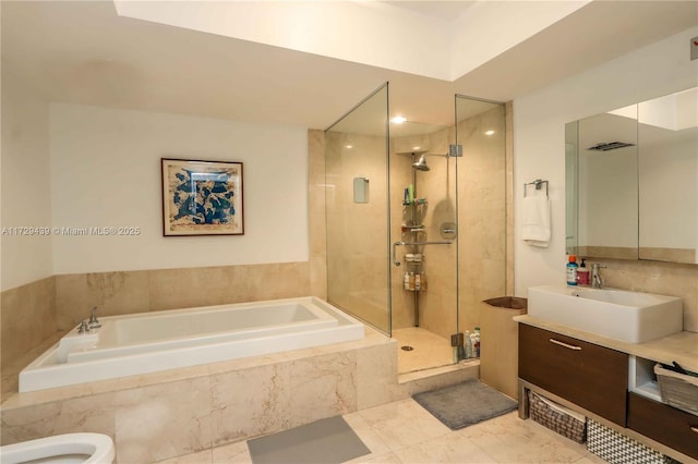 bathroom with tile patterned floors, vanity, and separate shower and tub