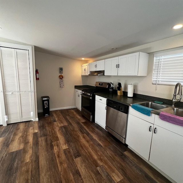 kitchen featuring white cabinetry, sink, dark hardwood / wood-style flooring, and appliances with stainless steel finishes