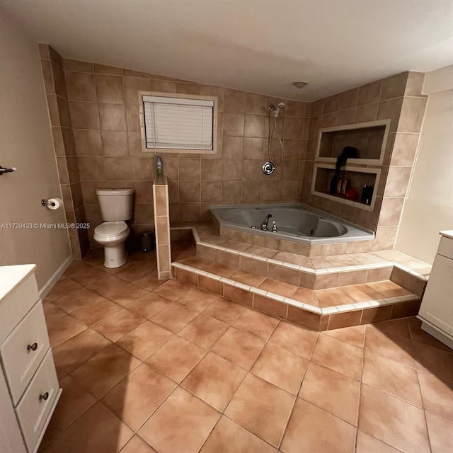 full bathroom with tile patterned flooring, tile walls, vanity, shower with separate bathtub, and toilet