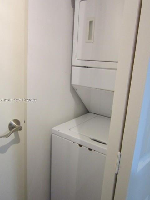 washroom with stacked washer and clothes dryer