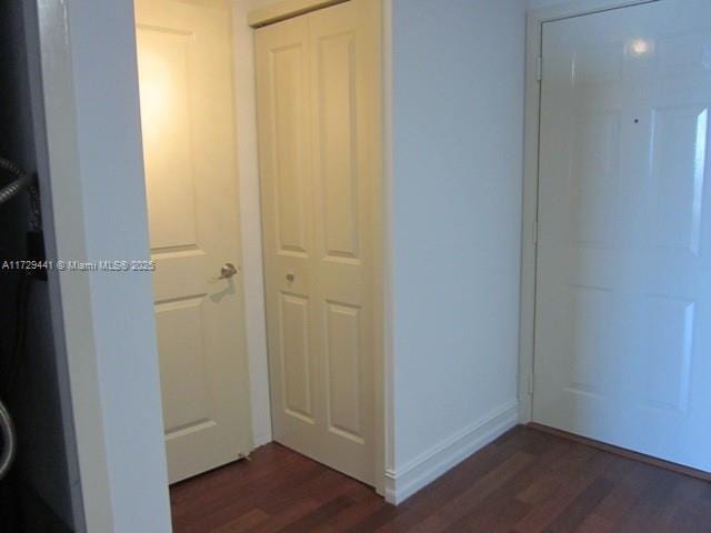 hallway featuring dark wood-type flooring