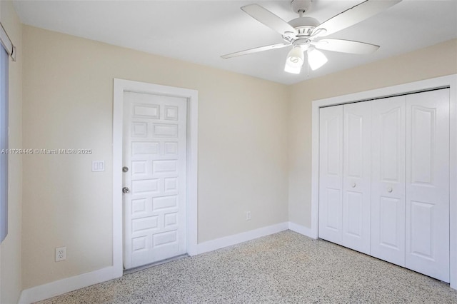 unfurnished bedroom with ceiling fan and a closet