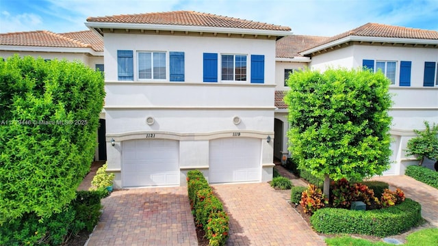 mediterranean / spanish-style house featuring a garage